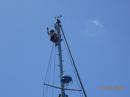 Sam climbs the mast